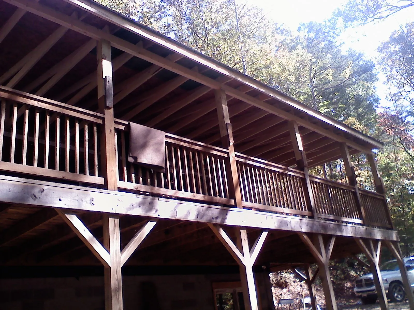 Timber framing under a new elevated porch and deck — Roof Leak Repair in New Waverly by Roofing Brothers